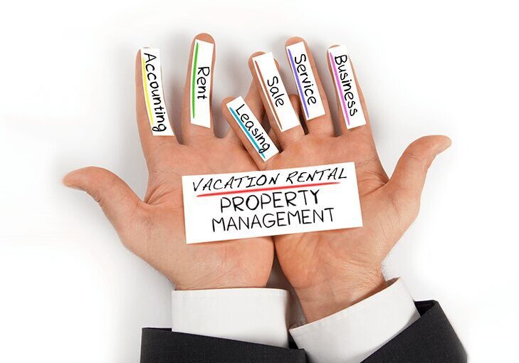 A person holding their hands up with the words vacation rental property management written on them.